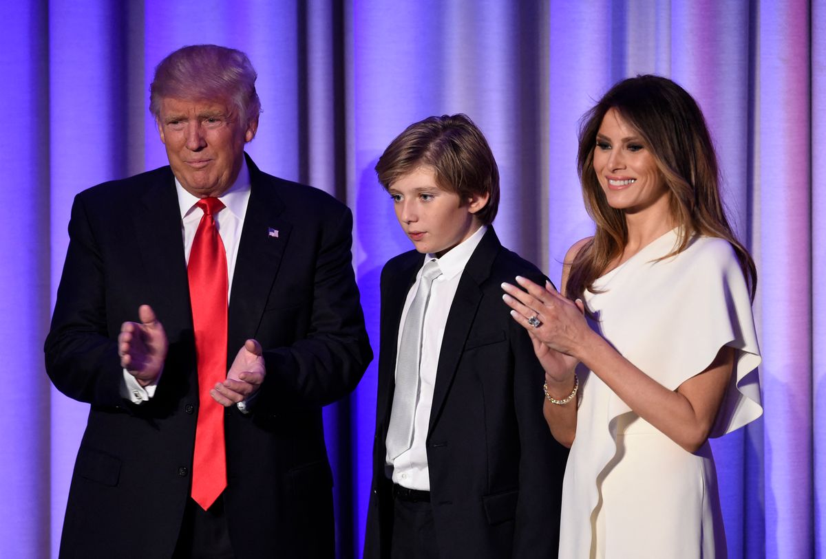 Donald Trump arrives with his son Baron and wife Melania at the New York Hilton Midtown in New York on November 8, 2016.