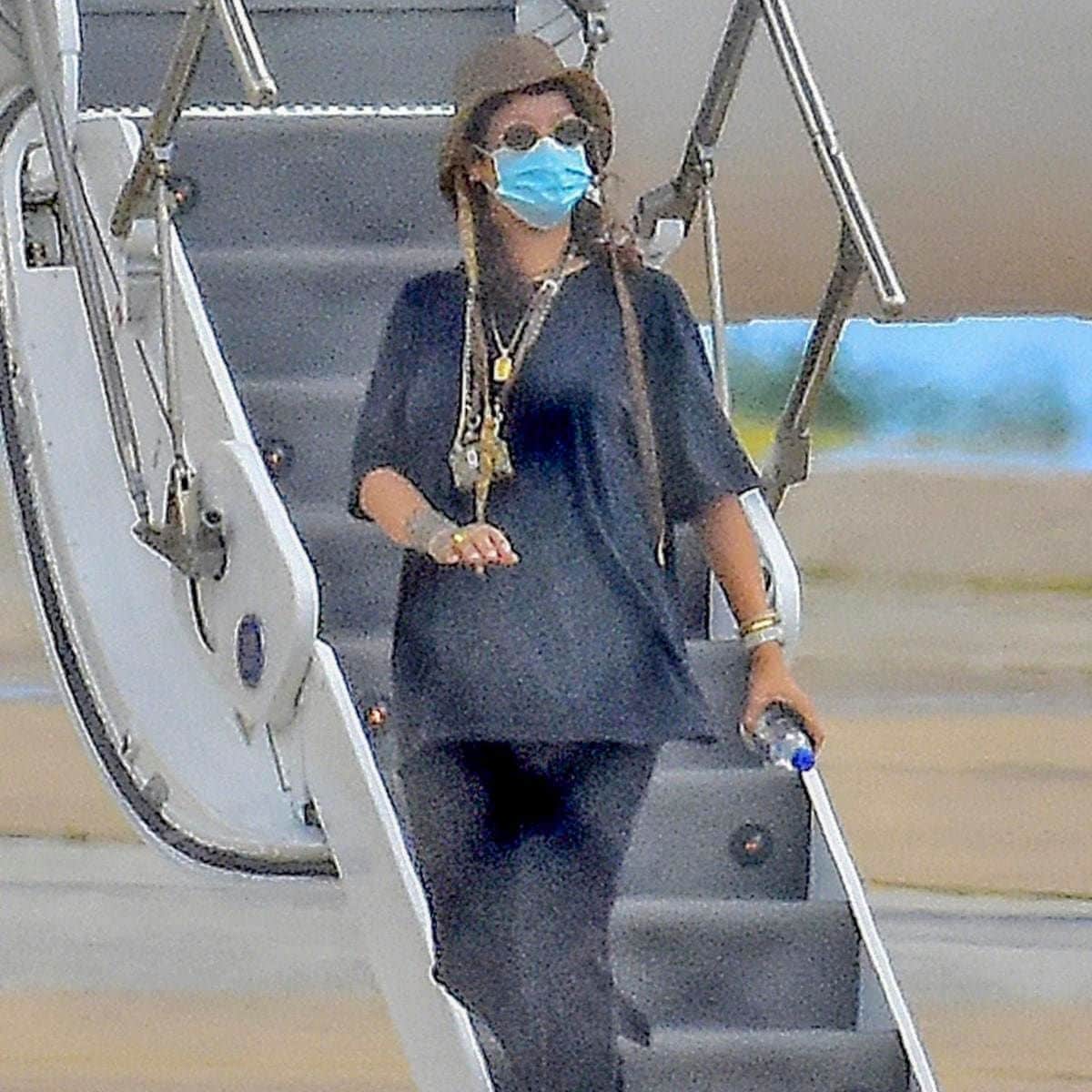 Rihanna pictured wearing a protective face mask and a lot of bling.