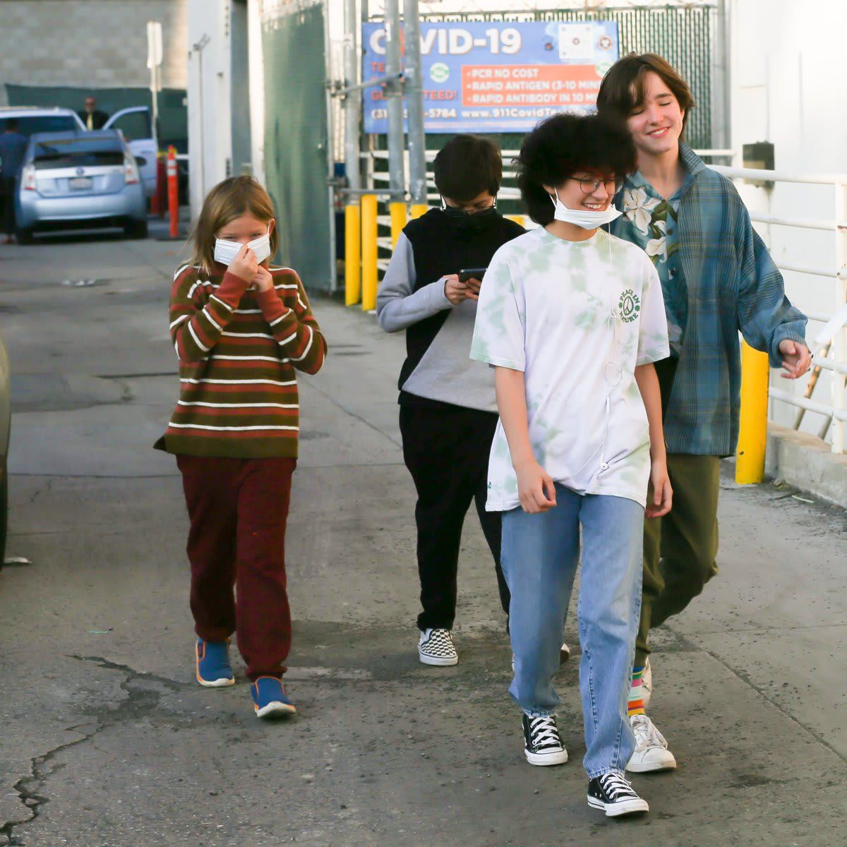 Ben Affleck and Jennifer Lopez hold hands as they head to the movies with their kids at Regency Theater in Westwood.