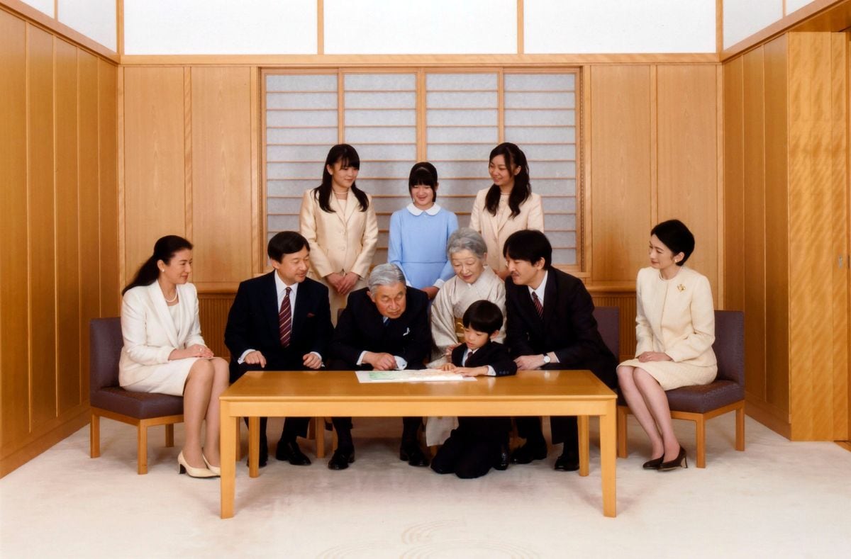 TOKYO, JAPAN - JANUARY 01: The japanese royal family, emperor Akihito, seated third left, accompanied by empress Michiko, seated third right, and crown prince Naruhito, seated second left, accompanied by his wife crown princess Masako, seated left, watch prince Hisahito, bottom center, son of prince Akishino, seated second right, and princess Kiko, seated right, with three princesses, standing are princess Mako, left, the first daughter of Akishino and Kiko, princess Aiko, center, daughter of Naruhito and Masako, and princess Kako, the second daughter of Akishino and Kiko, pose for a family photo session for the new year at the Imperial Palace on January 1, 2014 in Tokyo, Japan. 