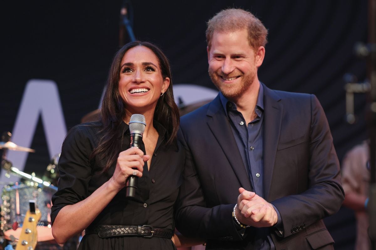 DUESSELDORF, GERMANY - SEPTEMBER 12: Prince Harry, Duke of Sussex and Meghan, Duchess of Sussex speak on stage at the "Friends @ Home Event" at the Station Airport during day three of the Invictus Games DÃ¼sseldorf 2023 on September 12, 2023 in Duesseldorf, Germany. (Photo by Chris Jackson/Getty Images for the Invictus Games Foundation)