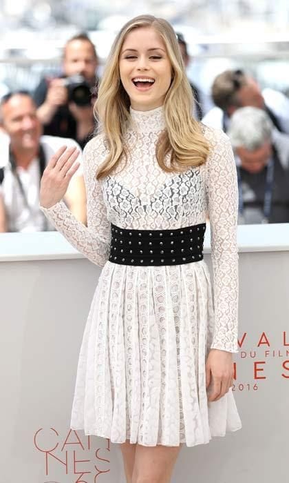 What this old thing? I just threw it on! Erin Moriarty enjoyed a giggle as she posed for photos in a stunning white lace dress and black studded belt.
<br>Photo: Getty Images