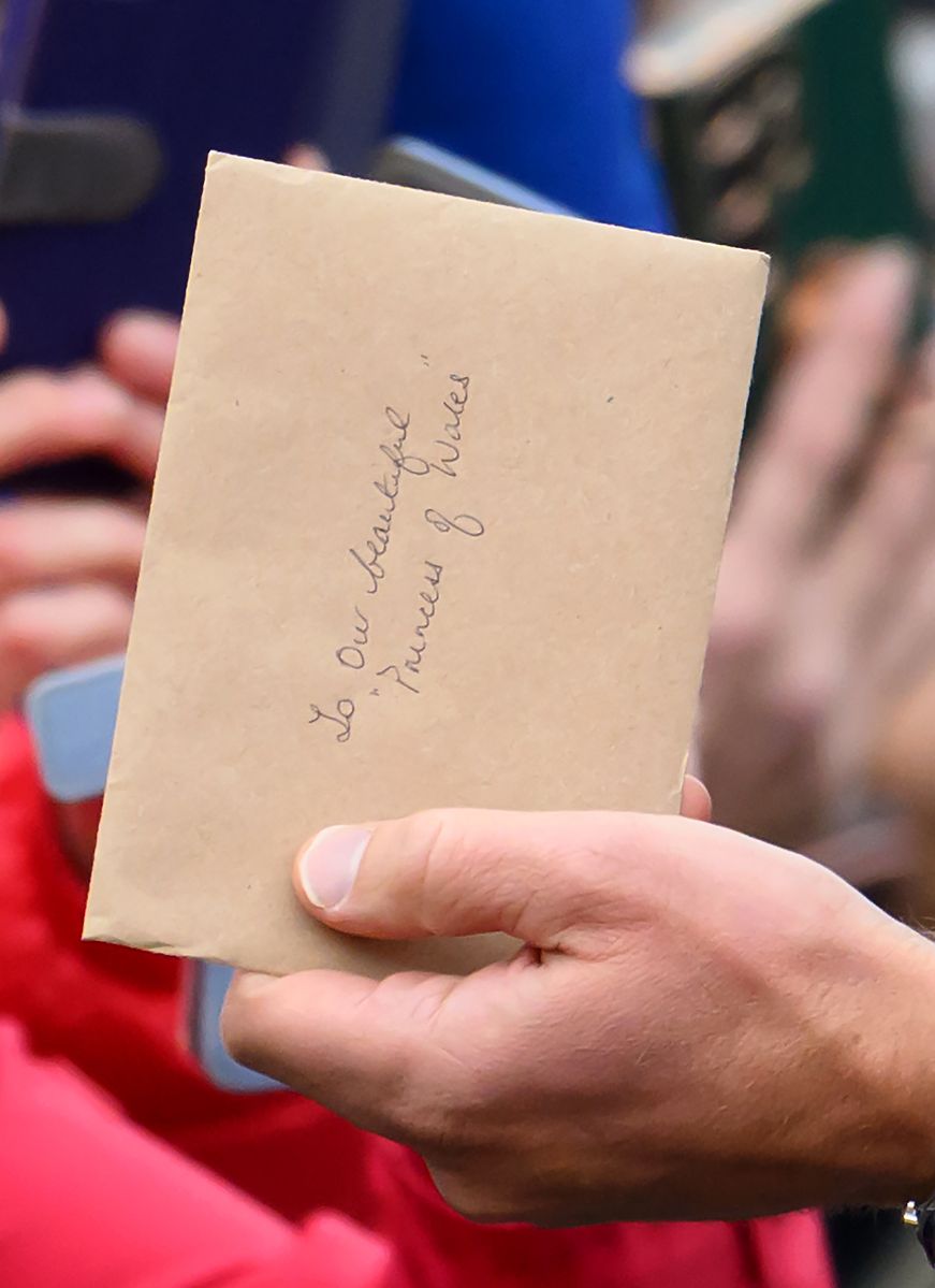 LLANELLI, WALES - SEPTEMBER 10: Prince William, Prince of Wales receives a letter addressed for the Princess of Wales during his visit to Swiss Valley Community Primary School on September 10, 2024 in Llanelli, Wales. The Prince of Wales visited Llanelli in South Wales on Tuesday to celebrate the region's rich culture and sporting achievements, while engaging with local residents. (Photo by Karwai Tang/WireImage)