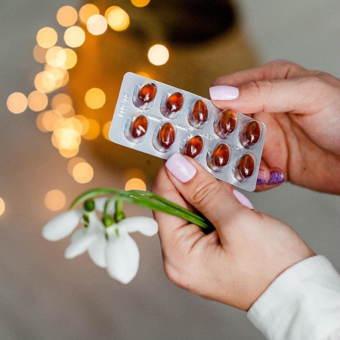 Person holding vitamins