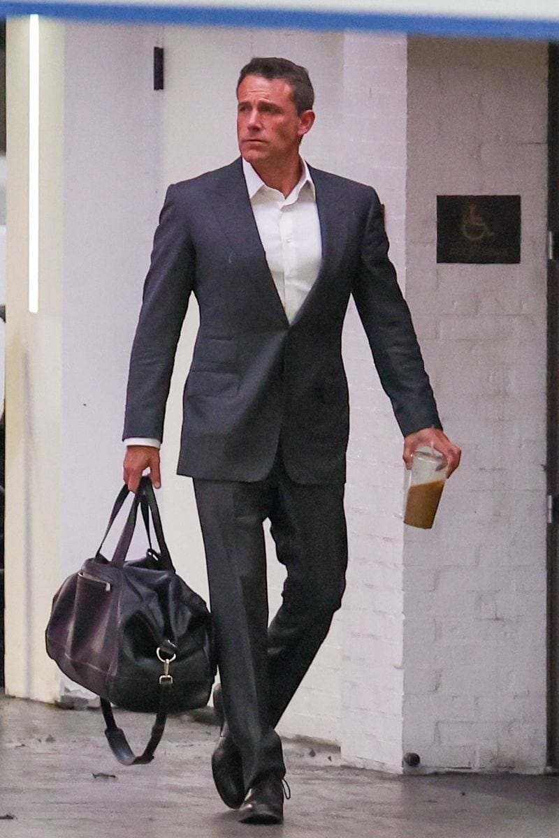 Ben Affleck arrived at his office looking sharp in a gray suit and carrying a leather duffel bag.