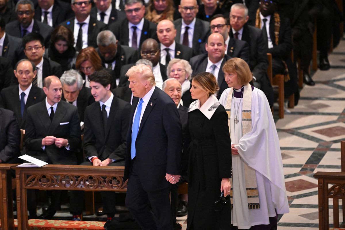 Donald Trump and former First Lady Melania Trump arrive to attend the State Funeral Service for former US President Jimmy Carter 