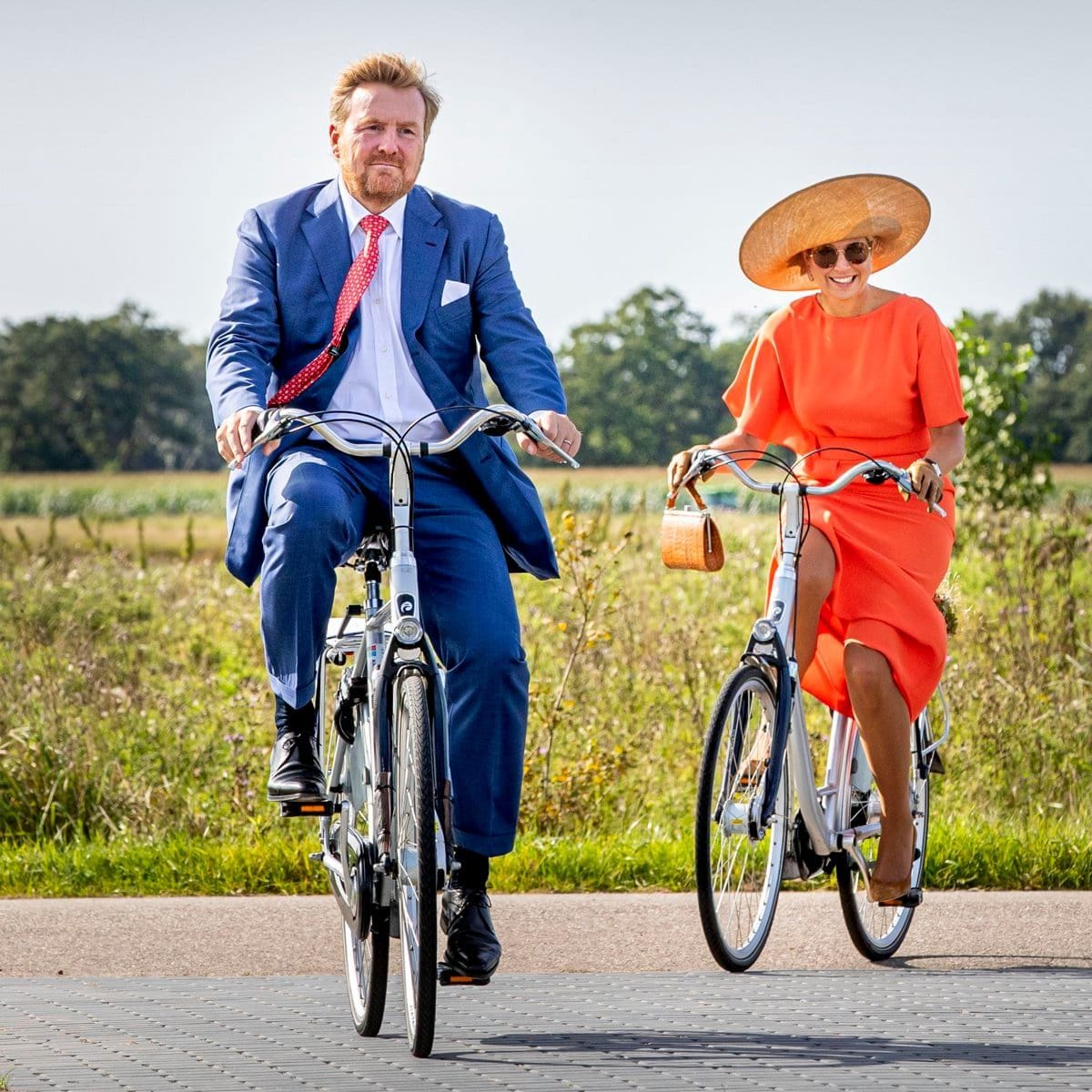 A dress and heels did not stop Queen Maxima from bike riding in Ooststellingswerf with King Willem-Alexander in 2020.