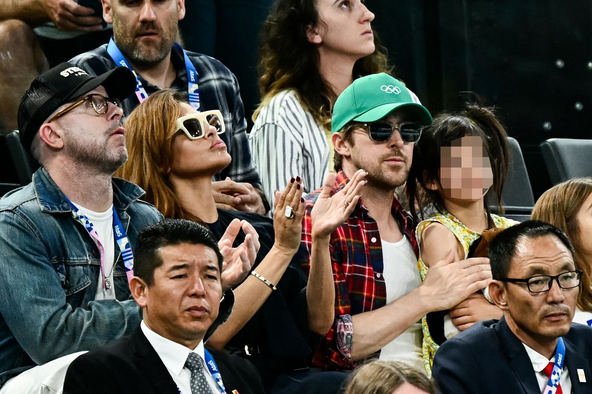 Eva Mendes and her Ryan Gosling attend the artistic gymnastics women's uneven bars final during the Paris 2024 Olympic Games.
