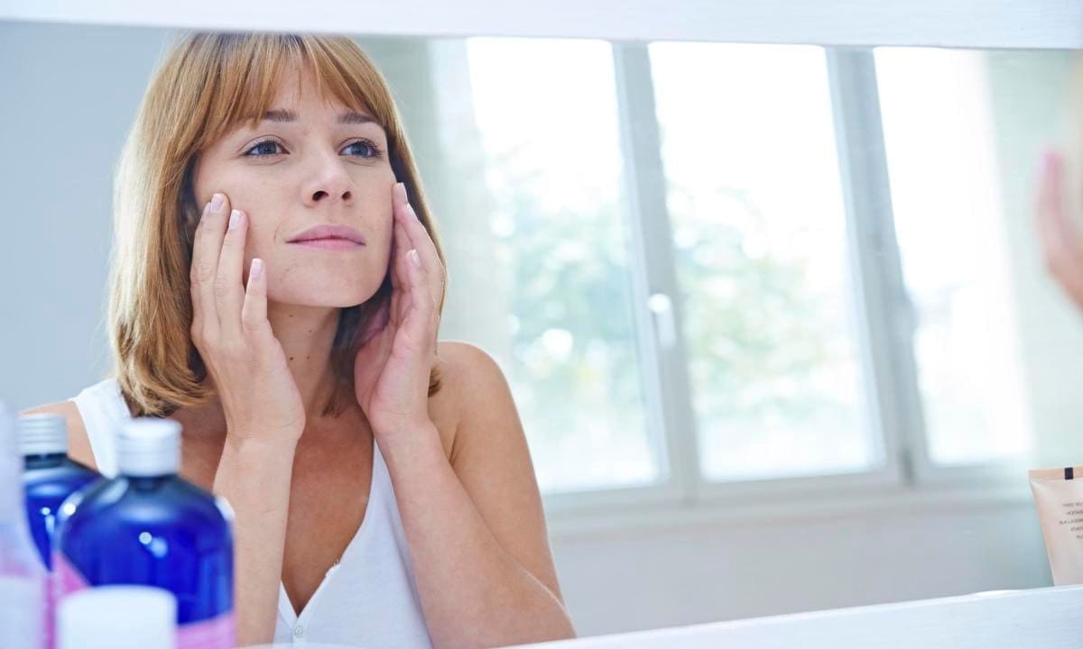 Woman looking in a mirror