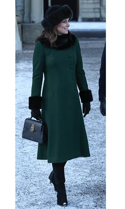 Earlier in the day Kate took a stroll with Prince William, future Queen <a href="https://us.hellomagazine.com/tags/1/crown-princess-victoria/"><strong>Crown Princess Victoria </strong></a> and Prince Daniel through the frosty streets of Stockholm. For the occasion, the Duchess kept warm in a bottle green coat by <a href="https://us.hellomagazine.com/tags/1/catherine-walker/"><strong>Catherine Walker</strong></a>, a black faux-fur trimmed hat which she has been wearing during winter, and the 'Mini Seaton' handbag by Mulberry.
Photo: WENN