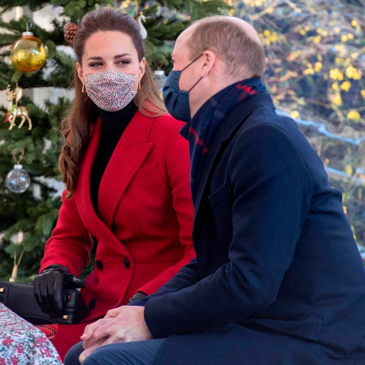 The parents of three exchanged sweet looks during their visit to Cleve Court Care Home.