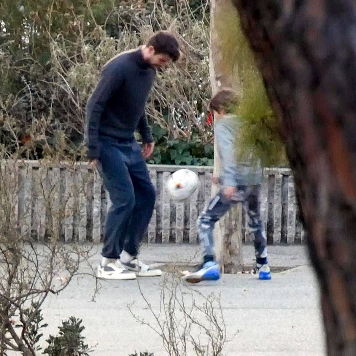 Gerard Pique plays soccer with his son Milan