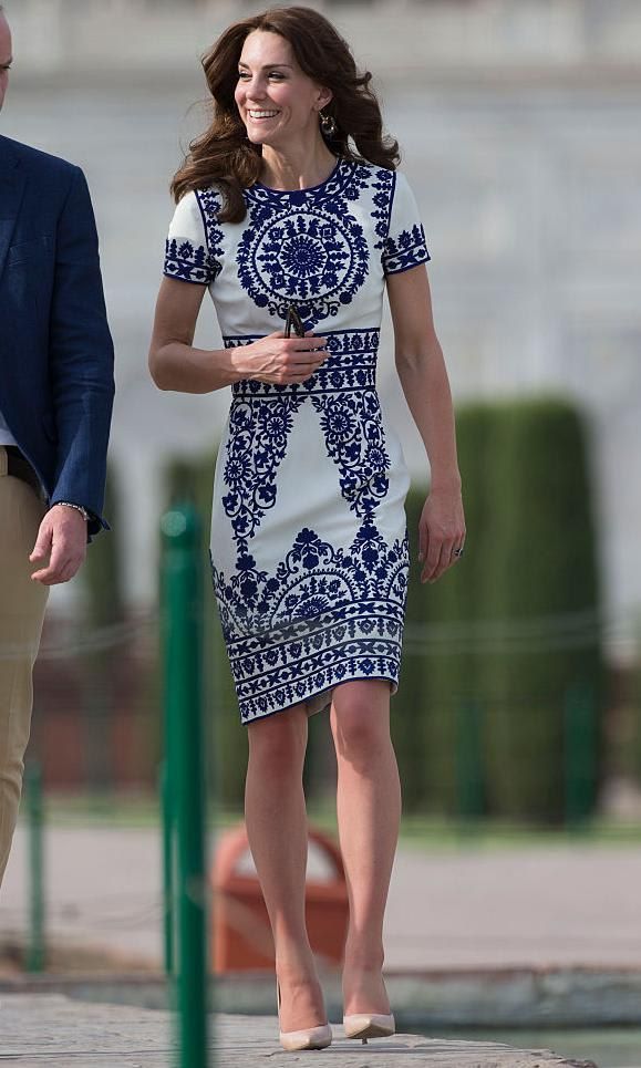 Kate Middleton in a white dress with blue embroidery