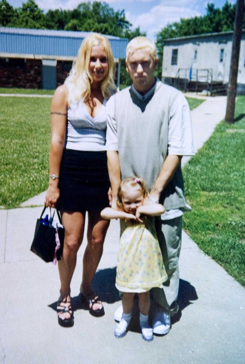 Eminem at his first wedding to Kimberly Anne Scott in 1999 with daughter Hailie outside the service. 