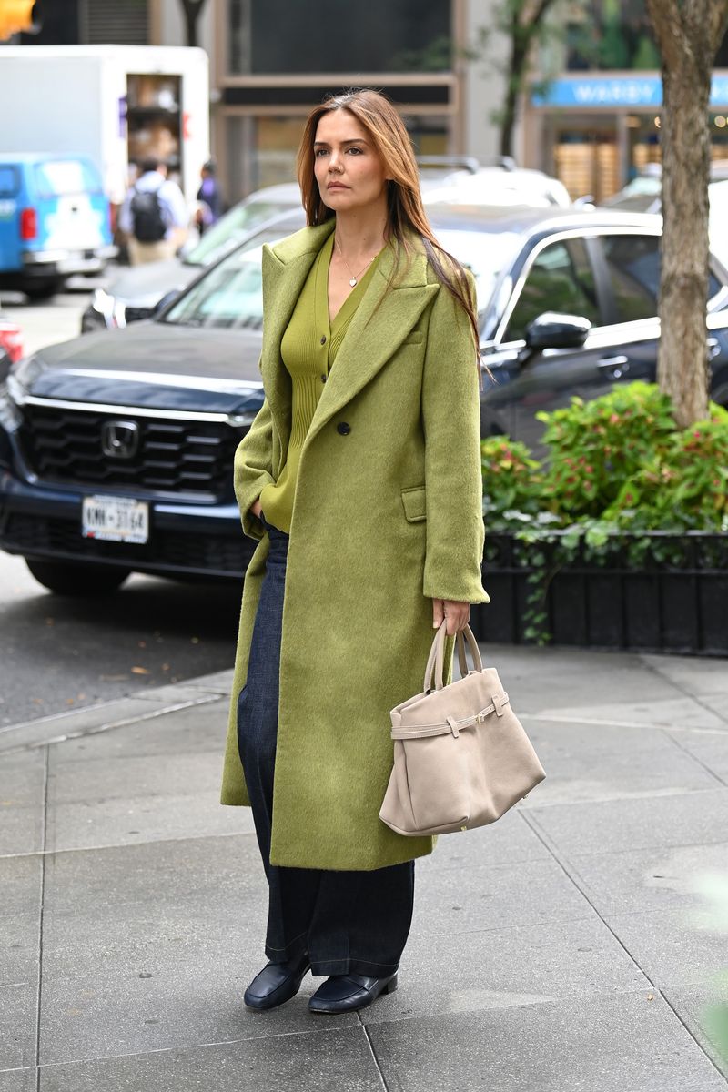 Katie Holmes looks stylish in a matching green coat and top whilst out in New York City.