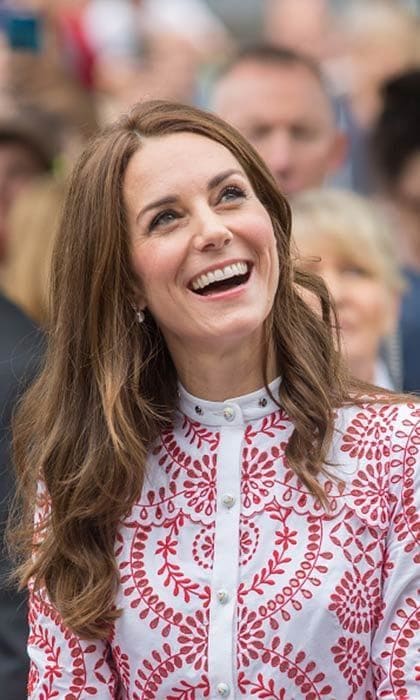 The Duchess of Cambridge opted for a tousled beach wave look as she visited the Immigrant Services Society's new Welcome House on September 25, 2016 in Vancouver, Canada.