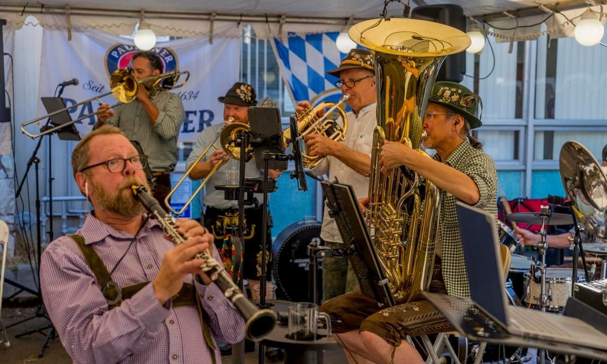 People enjoying the Oktoberfest celebrations with live music