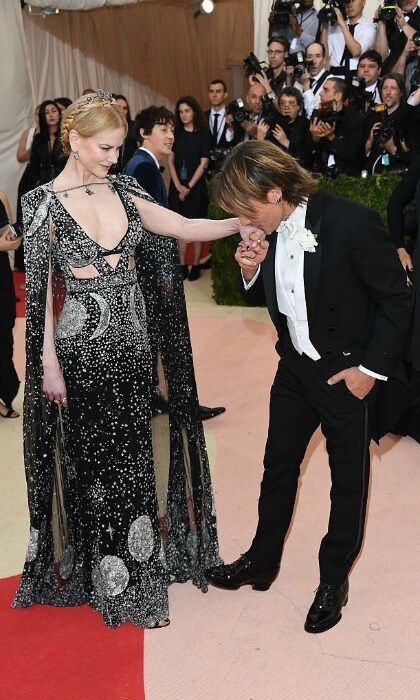 A kiss for his princess. The <i>Ripcord</i> artist kissed his stunning wife's hand at the Manus x Machina: Fashion In An Age Of Technology Costume Institute Gala.
<br>
Photo: Venturelli/FilmMagic