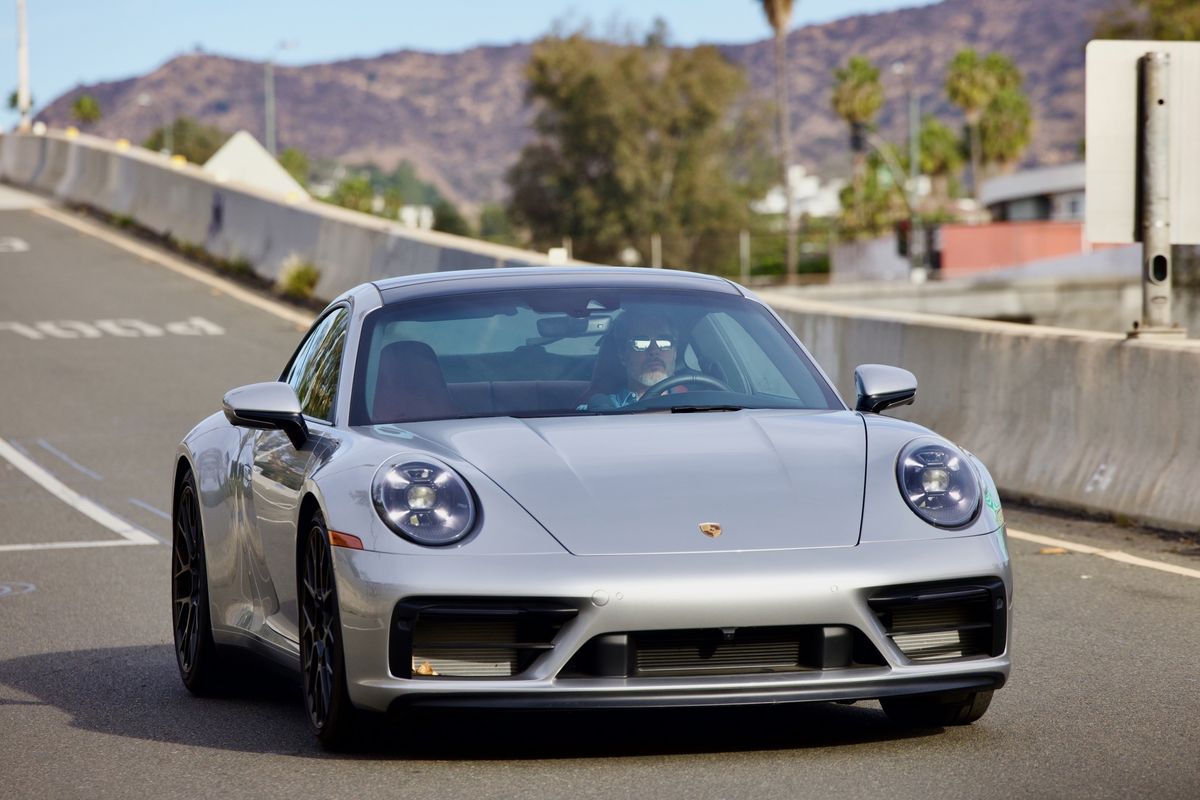 Pitt driving a Porsche