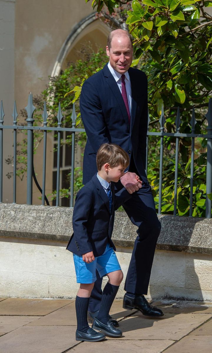 Louis left St. George's Chapel holding his dad Prince William's hand.