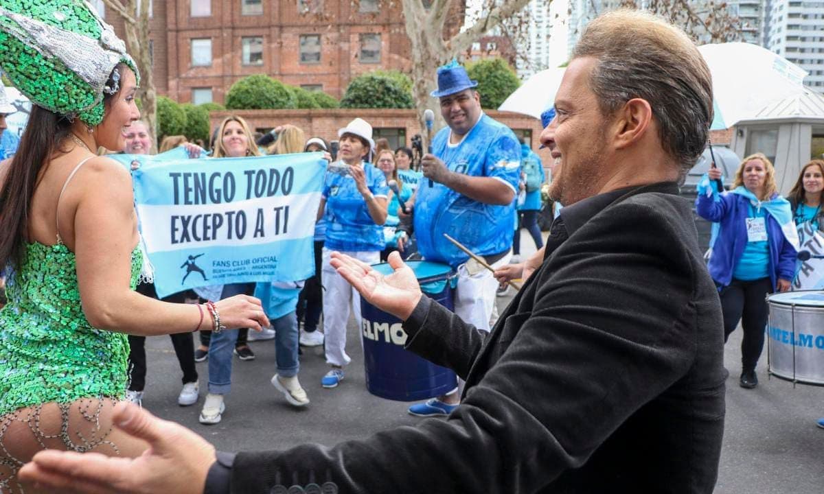 Luis Miguel singing and dancing his songs with devoted fans