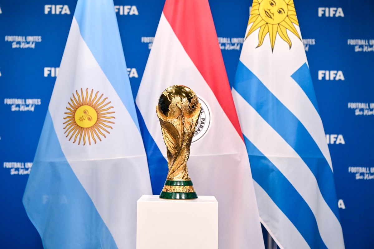 ZURICH, SWITZERLAND - DECEMBER 11: A view of the FIFA World Cup Winner's Trophy with the flags of the hosts of the matches of the FIFA World Cup 2030 Centenary Celebration Uruguay, Argentina and Paraguay during a trophy shoot at the Home of FIFA on December 11, 2024 in Zurich, Switzerland. (Photo by Harold Cunningham - FIFA/FIFA via Getty Images)