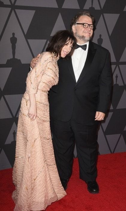 Sally Hawkins cozied up to her director and pal Guillermo del Toro as they walked into the lavish ceremony together. The 41-year-old actress wore a frilled dress that matched her skin tone, save for the shimmering silver and gold stripes that were wrapped across it.
Photo: Kevin Winter/Getty Images