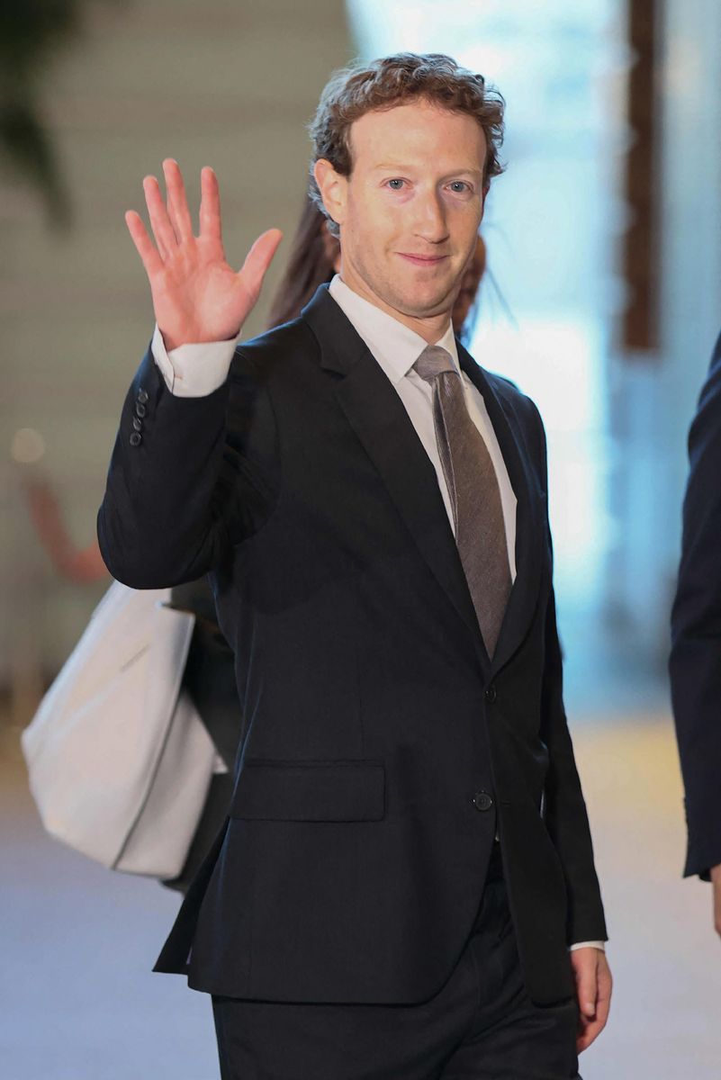 This photo taken on February 27, 2024 shows Mark Zuckerberg, head of US tech giant Meta, waving as he enters the Japanese prime minister's office during his visit to Tokyo. (Photo by JIJI Press / AFP) / Japan OUT (Photo by STR/JIJI Press/AFP via Getty Images)