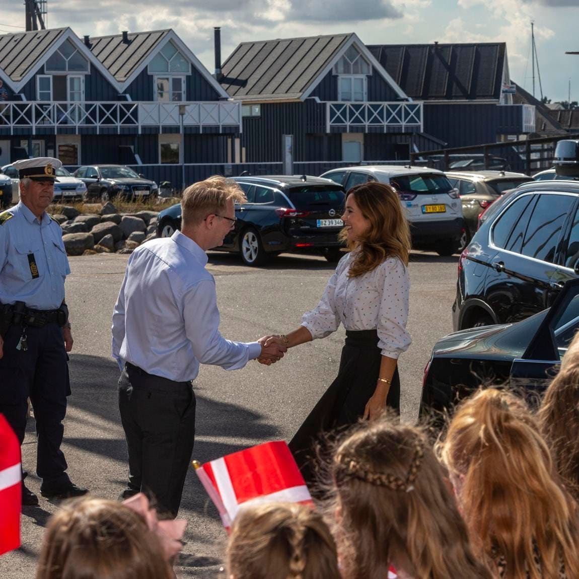 Crown Princess Mary encouraged everyone to take care of each other after mistakingly shaking hands during a royal engagement