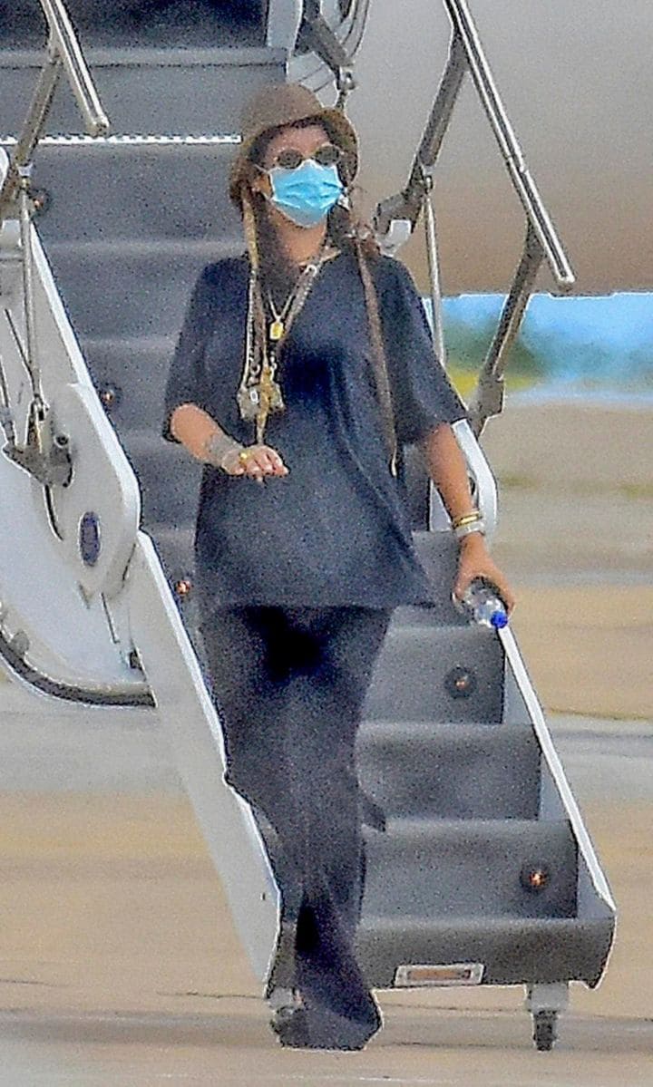 Rihanna stepping off a plane in Barbados