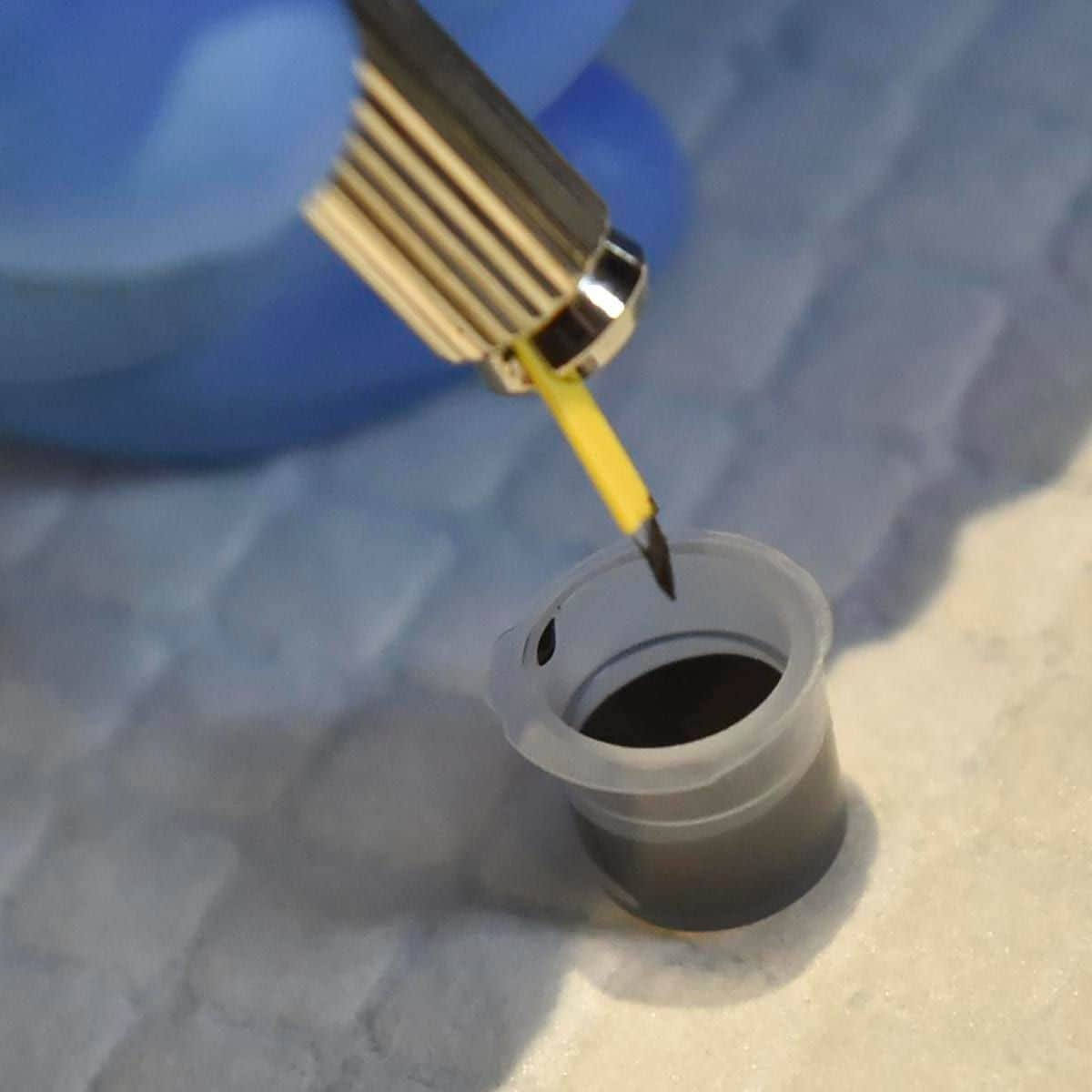 A detail photo of the blade being dipped into the ink. At the Bell Town Salon in Wyosmissing Friday evening September 15, 2017 where Shannon Solis was getting a touchup to her microblading eyebrow treatment. Photo by Ben Hasty