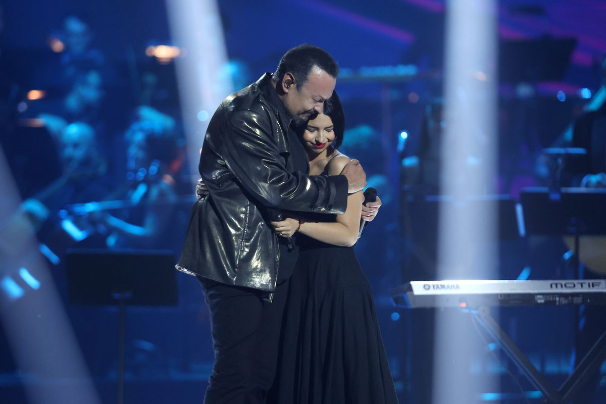 (L-R) Pepe Aguilar and Angela Aguilar embrace onstage during the Latin Recording Academy Person of The Year Honoring Laura Pausini at the FIBES Conference and Exhibition Centre on November 15, 2023, in Seville, Spain. (Photo by Vittorio Zunino Celotto/Getty Images for Latin Recording Academy)