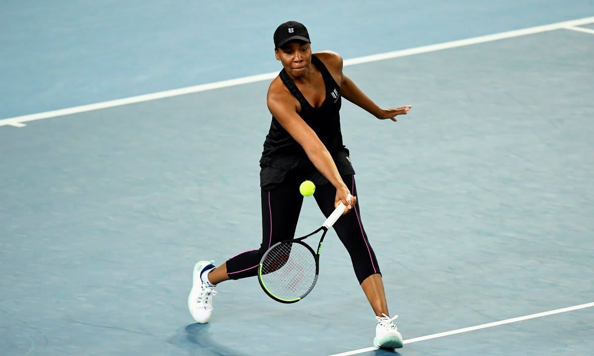 Venus Williams of the US hits a return against Czech Republic‘s Petra Kvitova during their Yarra Valley Classic women’s singles second round match