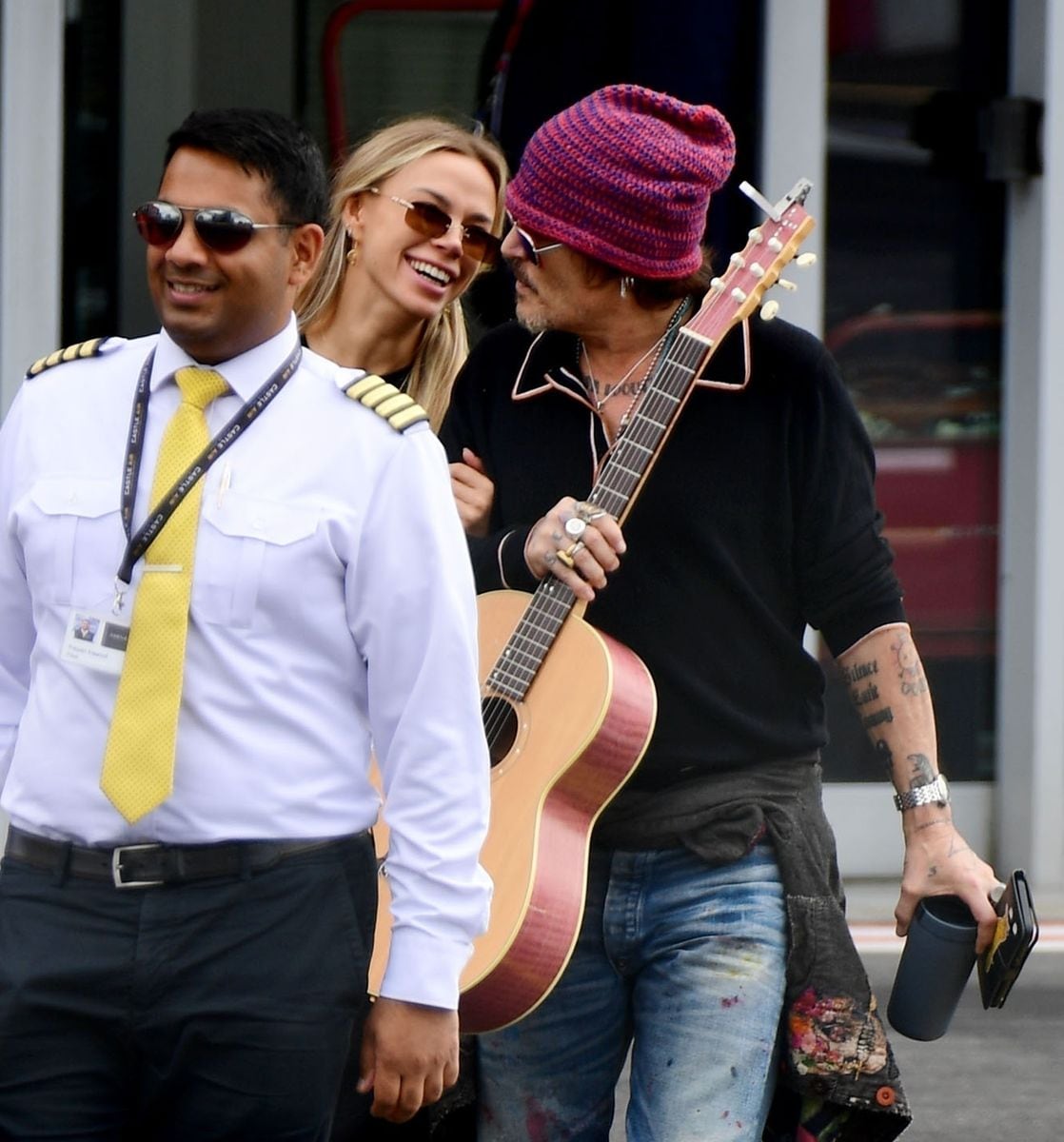 The couple was all smiles with Depp carrying his acoustic guitar ready to serenade 