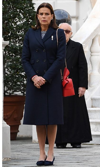 Princess Stephanie of Monaco kept things simple in red, white and blue. Grace Kelly's daughter wore a tailored coat over a navy and white dress, giving the look of pop of color with her red leather bag.
Photo: Getty Images