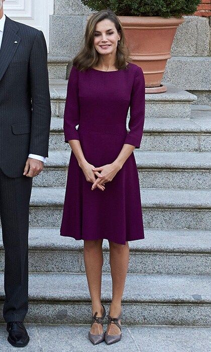 Underneath her stylish trench, Queen Letizia wore a purple day dress by BOSS Hugo Boss with her Magrit shoes. Here she stands on the steps of Zarzuela Palace before the official lunch for the Israeli president and his wife on November 6.
Photo: Carlos Alvarez/Getty Images