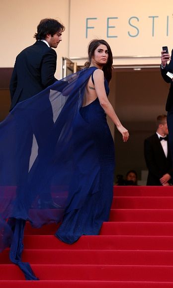 The cape to Nikki Reed's dress from Azzaro Couture (SS 2015) seemed to have life of its own as the actress ascended the steps with her then-boyfriend, now husband, Ian Somerhalder.
<br>
Photo: Getty Images