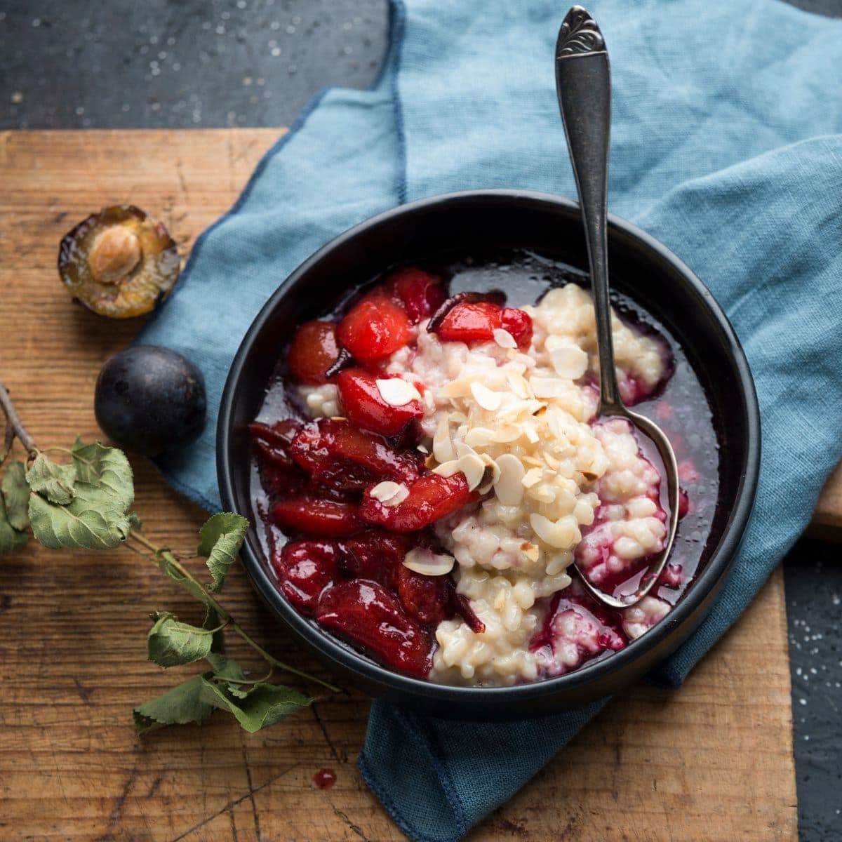 Vegan almond rice pudding with plum compote