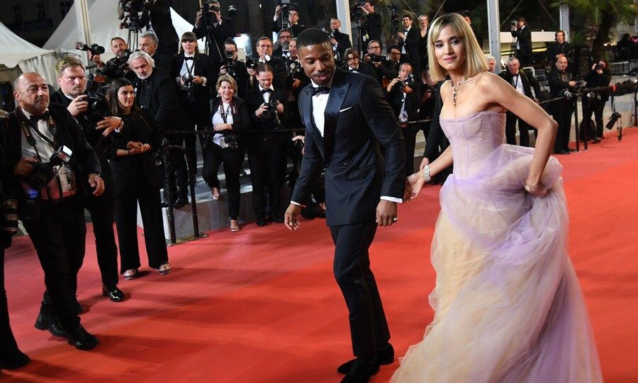 Michael B. Jordan watched where he stepped as he walked the <i>Farenheit 451</i> carpet with co-star Sofia Boutella.
Photo: Getty Images