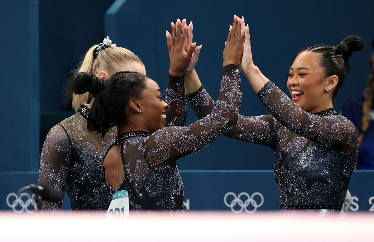 Simone Biles celebrates with teammate Sunisa Lee of Team United States during the Artistic Gymnastics Women's Qualification on day two of the Olympic Games Paris 2024 at Bercy Arena on July 28, 2024, in Paris, France. (Photo by Jamie Squire/Getty Images)