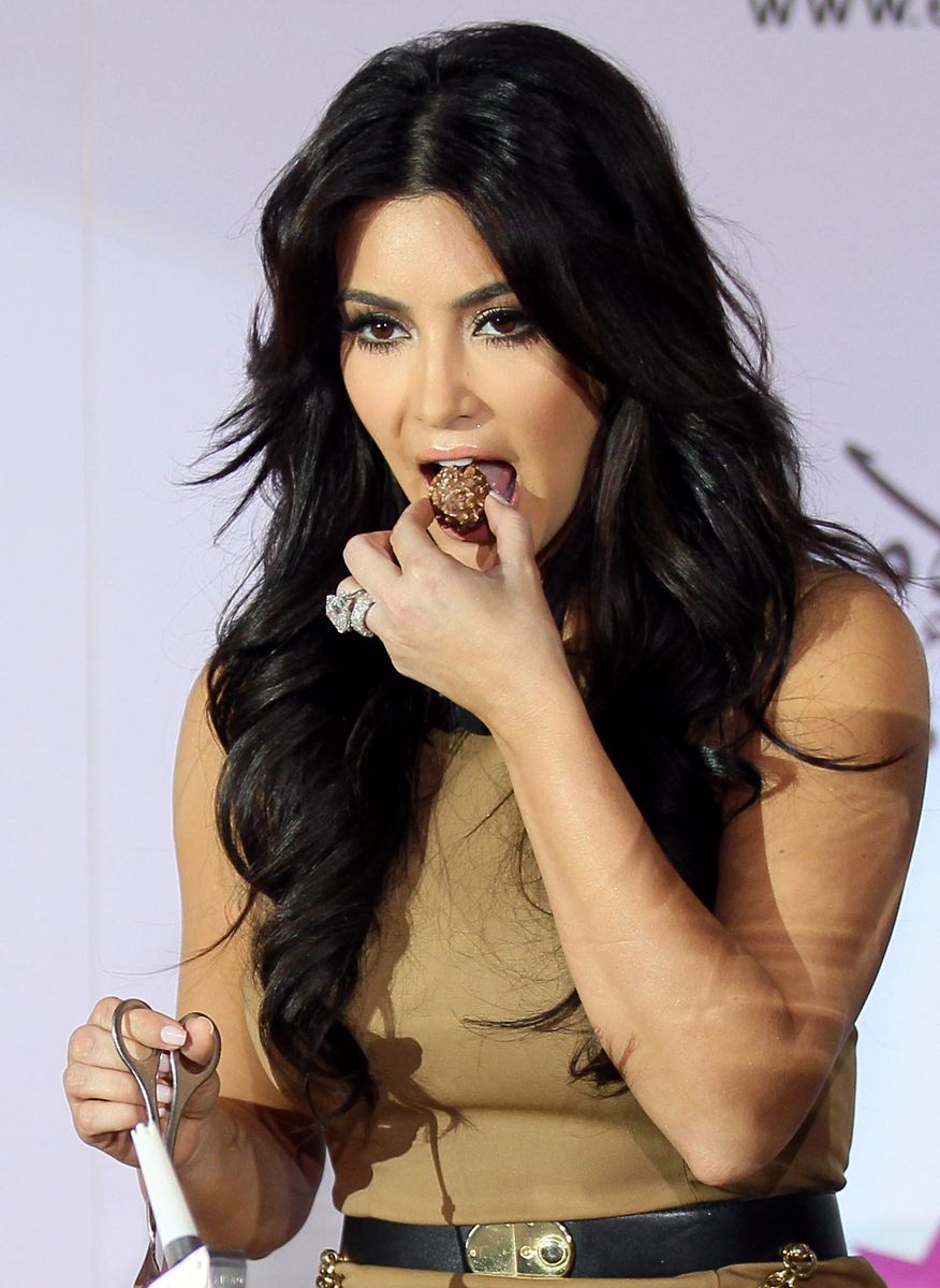 Kim Kardashian enjoys a sweet treat in 2011