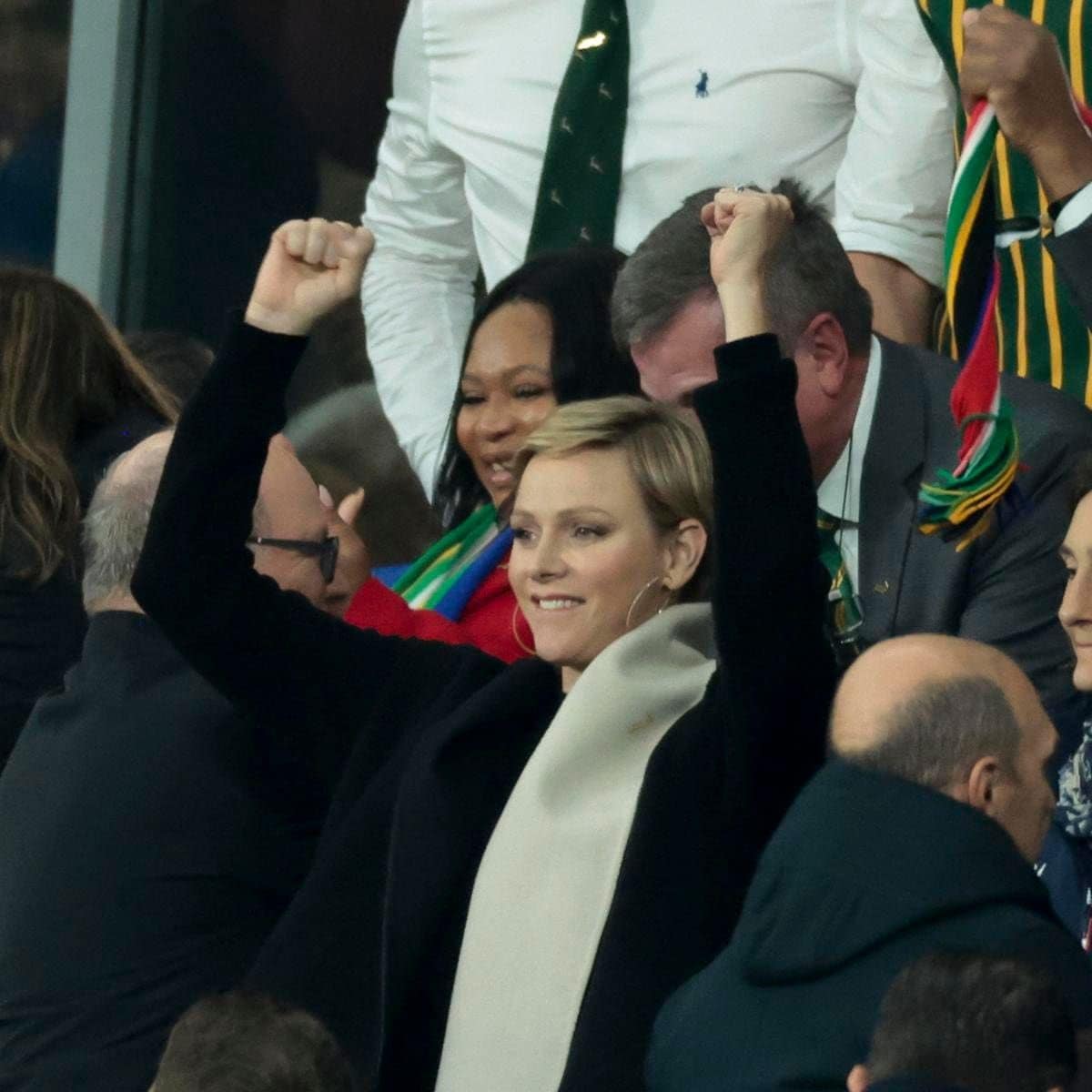 The Princess was also pictured raising her arms in the air during the match.