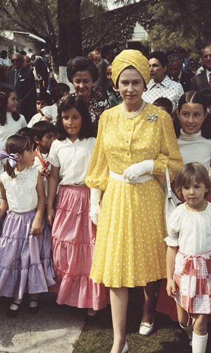 The Queen was a ray of sunshine in a yellow polka-dot ensemble with a group of local children during her state visit to Mexico in 1975.
<br>
Photo: Getty Images