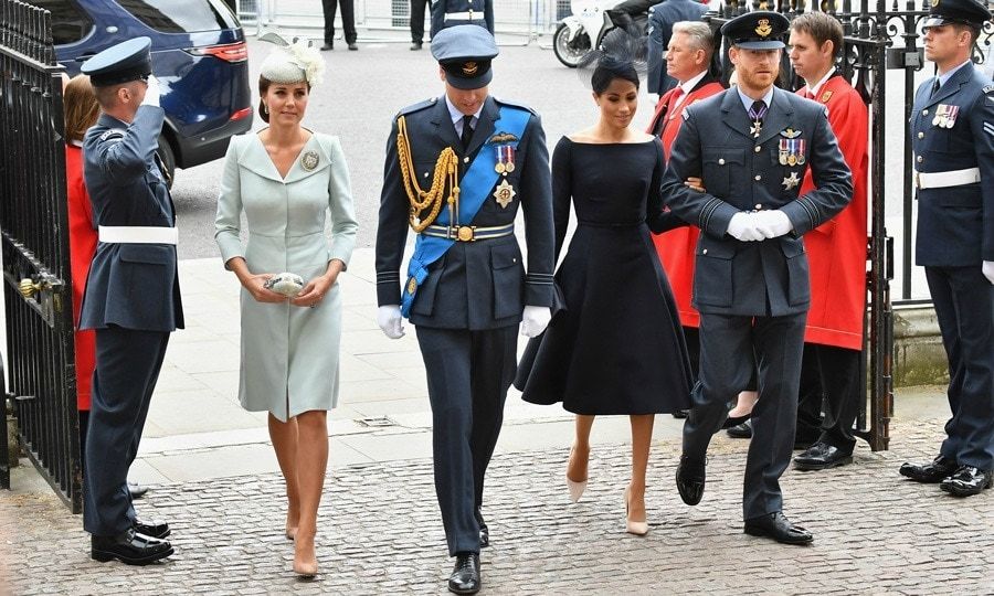 Flypast fashion! One day after her son Prince Louis' christening, Kate Middleton made a sweet surprise appearance alongside her royal relatives. The Duchess of Cambridge joined her husband Prince William, as well as Prince Harry and Meghan Markle at Westminster Abbey to mark the centenary of the Royal Air Force on Tuesday, July 10. The mom-of-three, who is still on maternity leave, looked characteristically elegant wearing her go-to designer Alexander McQueen.
The Duchess' pale blue bespoke coat dress featured winged lapels and a tailored bodice. Kate completed her look on Tuesday with a Sean Barrett hat, Her Majesty's teardrop earrings, Gianvito Rossi pumps and her Air Cadets Dacre Brooch, which is considered the highest award any female Air Cadet can achieve.
Other royal fashion icon Meghan donned a custom black Dior dress. The fitted frock featured a neckline reminiscent of her Givenchy wedding dress, with a black fascinator by Stephen Jones. She completed her looked with a simple black clutch and pale heels also by Dior.
The Princes looked dapper in formal attire.
Photo: Getty Images