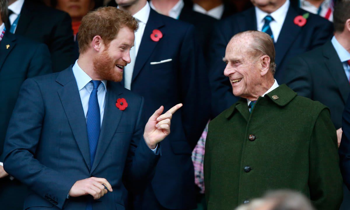 The Duke of Edinburgh shared a laugh with Prince Harry at the 2015 Rugby World Cup Final match between New Zealand and Australia.