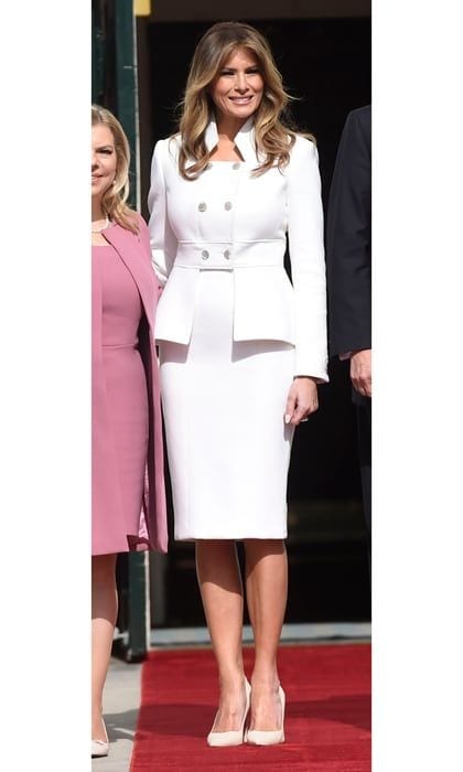 The first lady was a vision in white stepping out in a custom ensemble by Karl Lagerfeld to welcome Israeli Prime Minister Benjamin Netanyahu and his wife, Sara, to the White House on February 15, marking her first official appearance at the presidential residence since her husband's inauguration. Melania wore a cashmere pencil skirt and matching peplum double breasted jacket that featured a military-style collar for the occasion.
Photo: SAUL LOEB/AFP/Getty Images