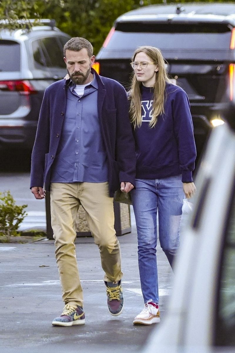 
Ben Affleck takes a walk with his daughter Violet, who bears a striking resemblance to her mother, Jennifer Garner. Violet walks with her arm around her dad, and the two appear to share a close 