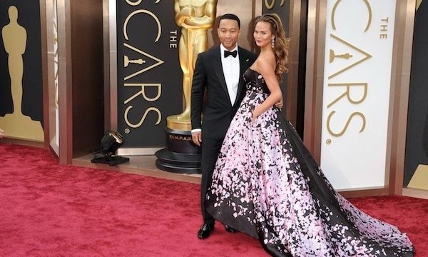 John Legend and Chrissy Teigen make quite the entrance at 2014's Oscars.