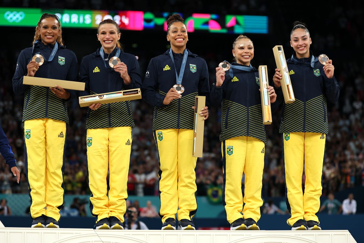 Bronze medalists, Team Brazil celebrate on the podium during the medal ceremony for the Artistic Gymnastics Women's Team Final on day four of the Olympic Games Paris 2024 at Bercy Arena on July 30, 2024, in Paris, France. (Photo by Naomi Baker/Getty Images)