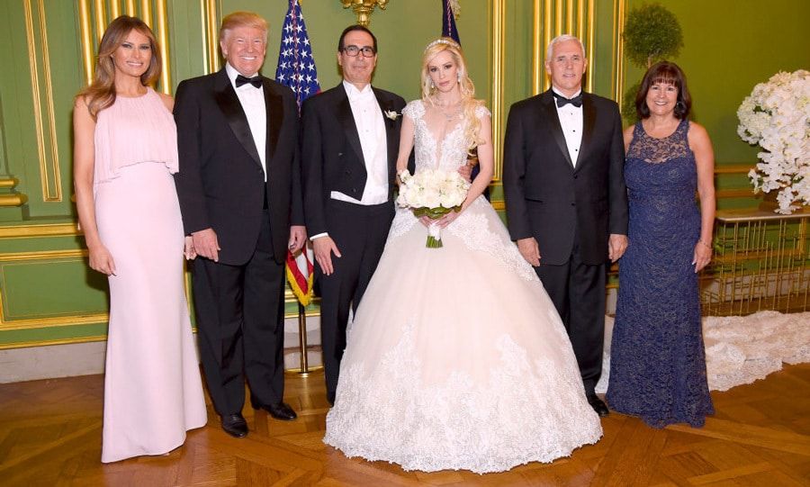 Melania Trump was a blushing guest at Treasury Secretary Steven Mnuchin and actress Louise Linton's wedding in Washington, D.C on June 24.
President Trump's wife wore a J. Mendel gown with a pleated bodice and draped lower in the back. She kept her locks flowing and makeup simple. As for the bride, her gown was by Ines Di Santo and her wedding ring and earrings are from Martin Katz.
Photo: Getty Images